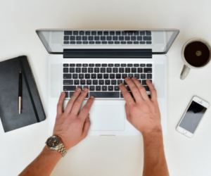 person typing on computer
